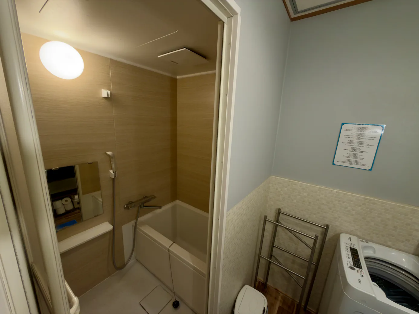 the bathroom: a bathtub with a shower
