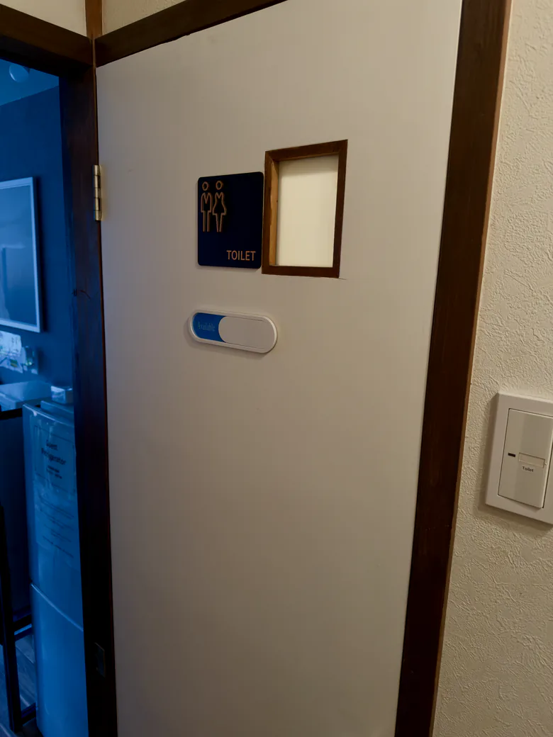 the shared toilet, off the same hallway