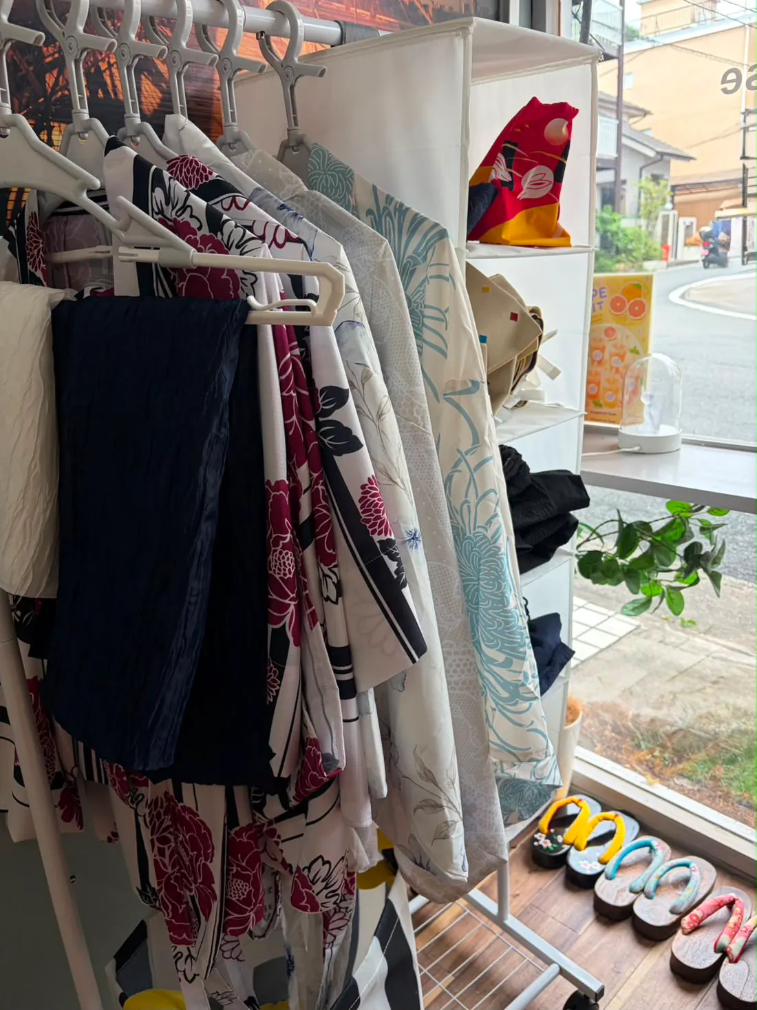 the yukata of the Arashiyama house, glimpsed through the curtain